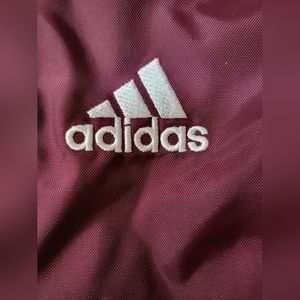 Large adidas track pants.  Size Large. Wine in color.